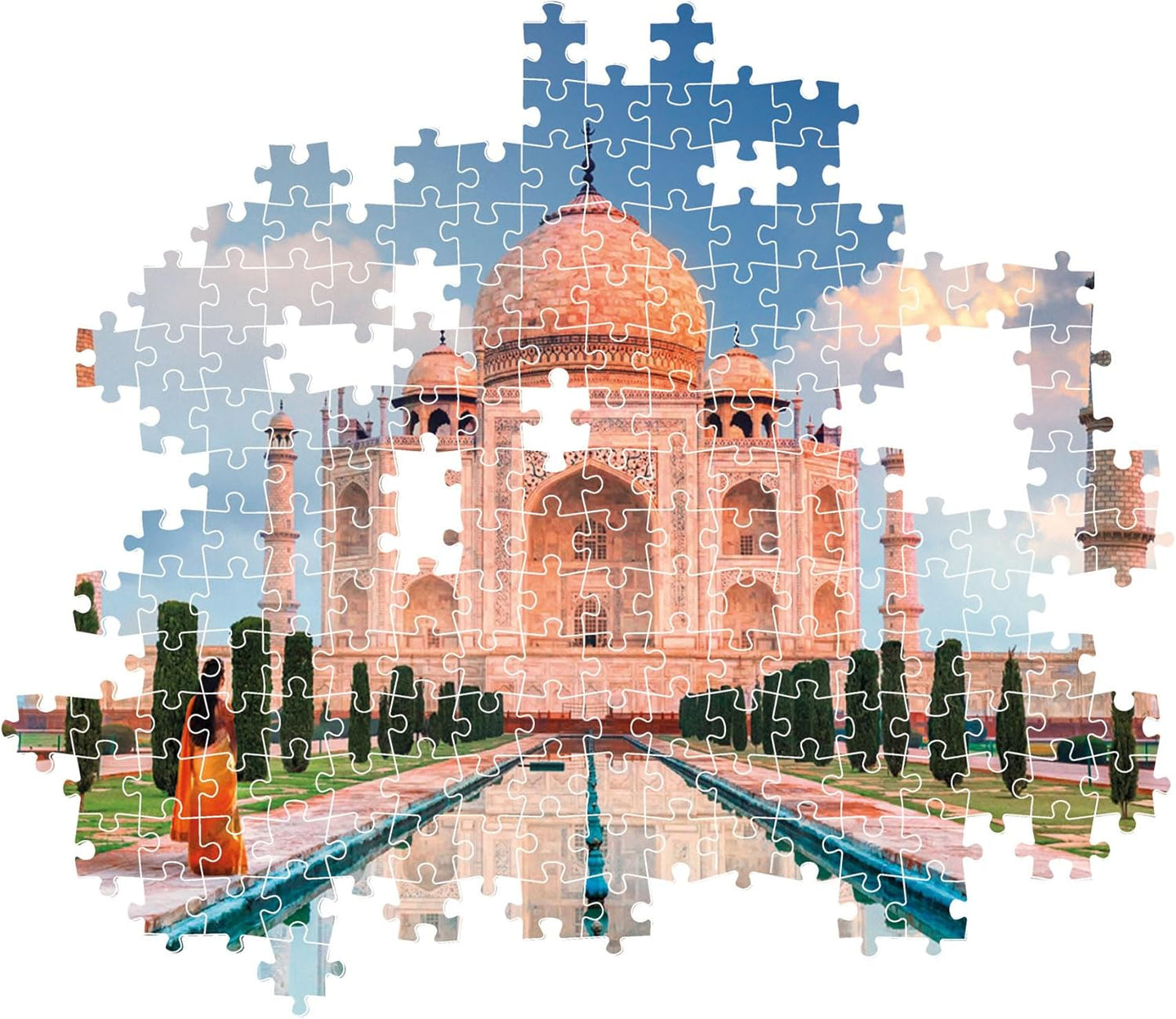 Montaje parcial del puzzle Taj Mahal 1500 piezas Clementoni, con piezas ensambladas del mausoleo y su reflejo en el estanque y piezas sueltas alrededor
