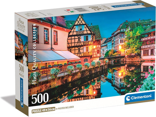 Caja del puzzle Casco Antiguo de Estrasburgo de 500 piezas de Clementoni, con casas de entramado de madera junto al canal reflejadas en el agua al anochecer