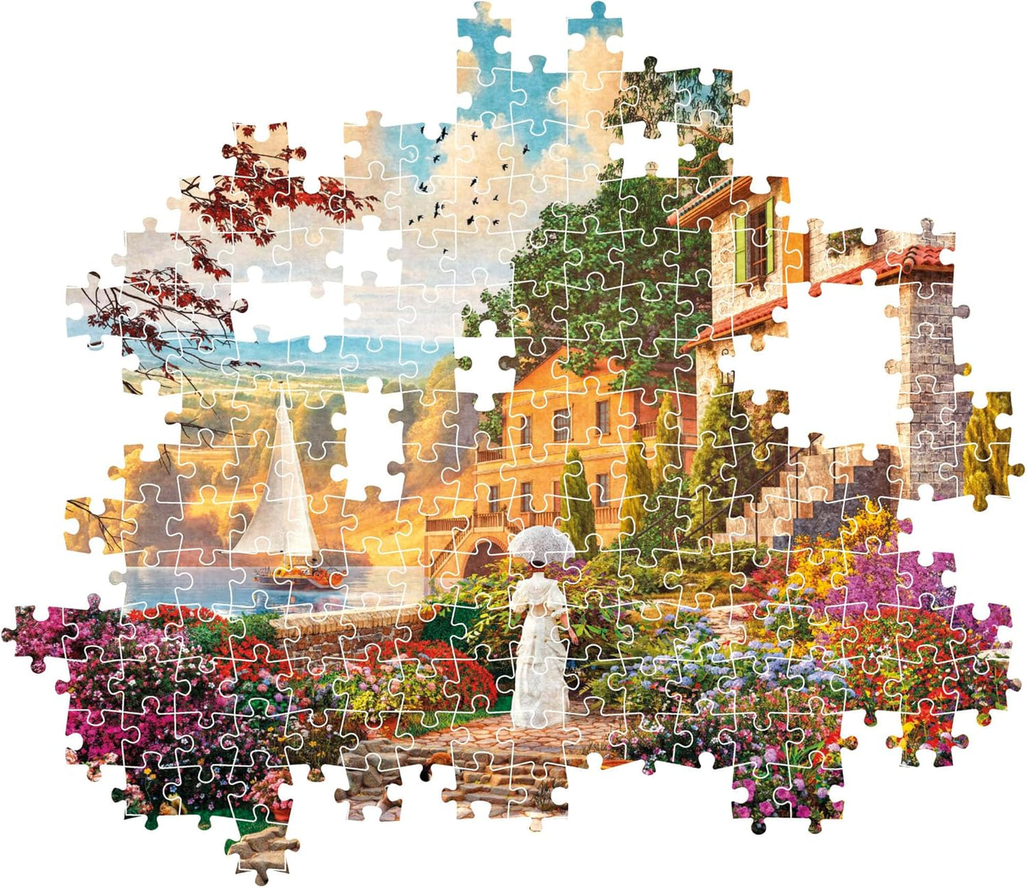 Montaje parcial del Puzzle Paseo Victoriano 500 piezas Clementoni, con piezas encajadas mostrando la escena de la mujer en el jardín florido junto a la casa de piedra y el lago, y piezas sueltas alrededor.