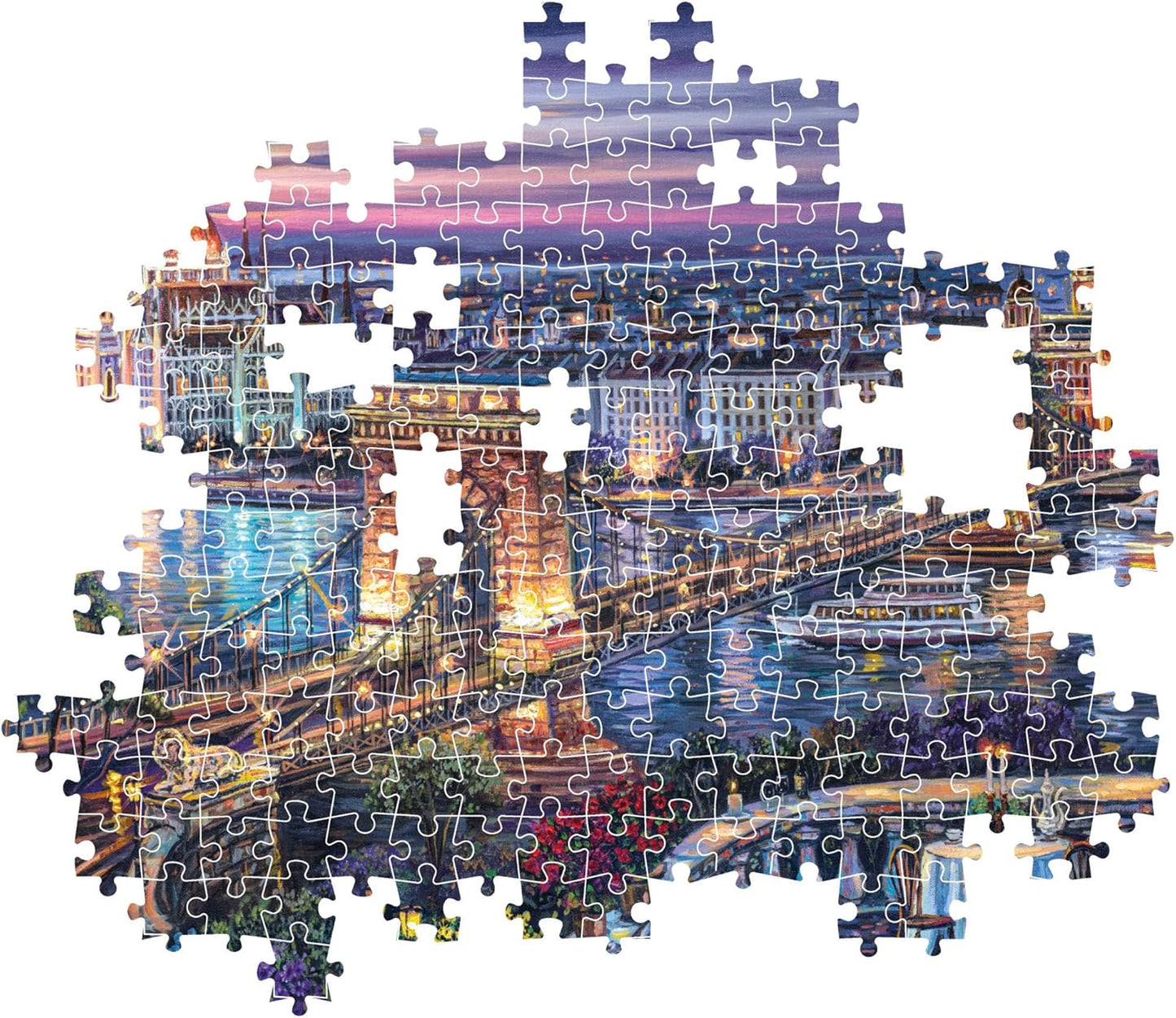 Montaje parcial del Puzzle Paisaje Nocturno de Budapest 1000 piezas Clementoni, con piezas encajadas mostrando el Puente de las Cadenas sobre el Danubio y piezas sueltas alrededor.