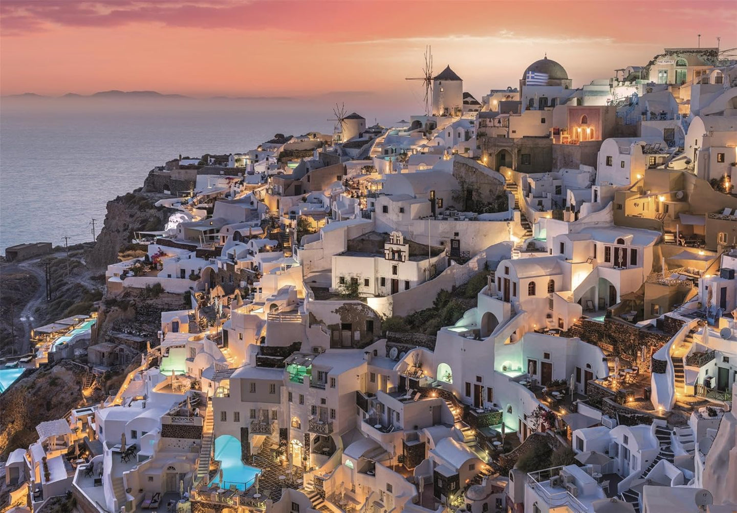Ilustración del puzzle Santorini 1000 piezas Clementoni con las casas blancas encaladas y los molinos de Oía al atardecer sobre el mar Egeo