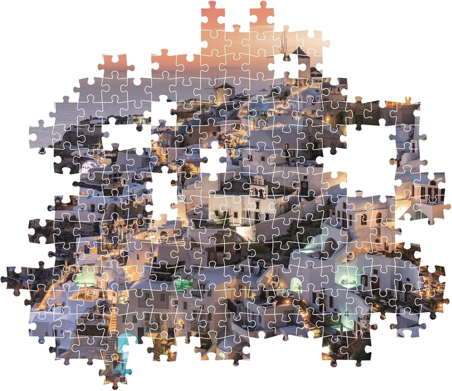 Montaje parcial del puzzle Santorini 1000 piezas Clementoni con piezas sueltas mostrando las casas blancas y el atardecer