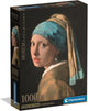Caja del puzzle La Joven de la Perla 1000 piezas Clementoni, colección Museum Collection, con el retrato de Vermeer de una joven con turbante azul y pendiente de perla sobre fondo negro