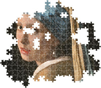 Montaje parcial del puzzle La Joven de la Perla 1000 piezas Clementoni, con piezas ensambladas del rostro y el turbante azul y piezas sueltas alrededor