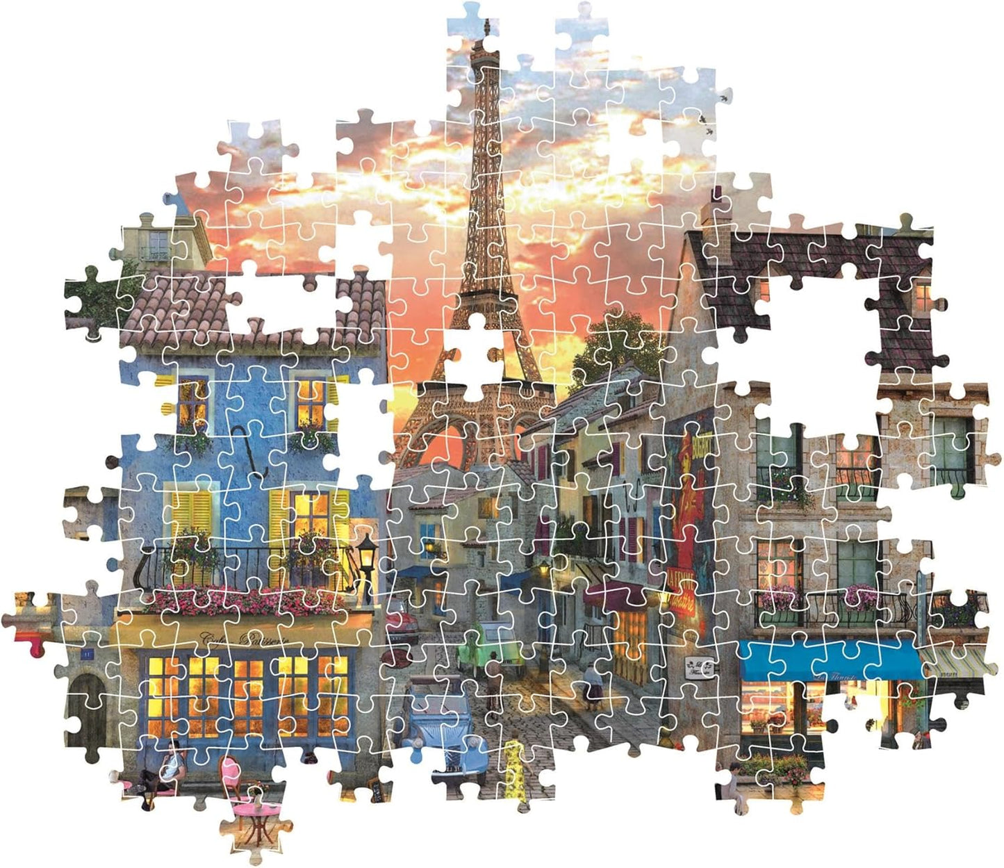 Montaje parcial del puzzle Calle de París 1000 piezas Clementoni con piezas sueltas mostrando la calle parisina y la Torre Eiffel