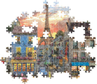 Montaje parcial del puzzle Calle de París 1000 piezas Clementoni con piezas sueltas mostrando la calle parisina y la Torre Eiffel