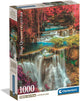 Caja del puzzle Cascadas Coloridas 1000 piezas Clementoni con cascadas escalonadas de aguas turquesa en un bosque otoñal de hojas rojas